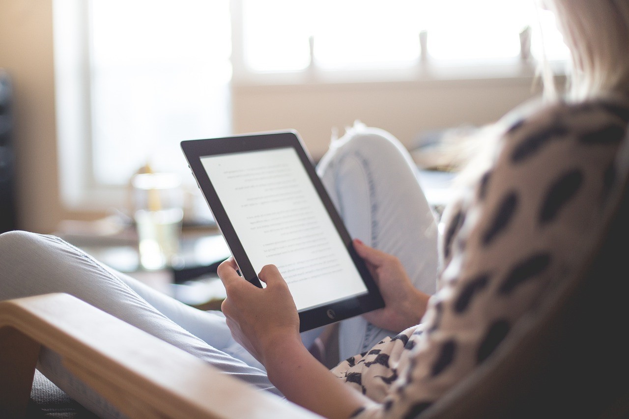 woman learning a language on a tablet